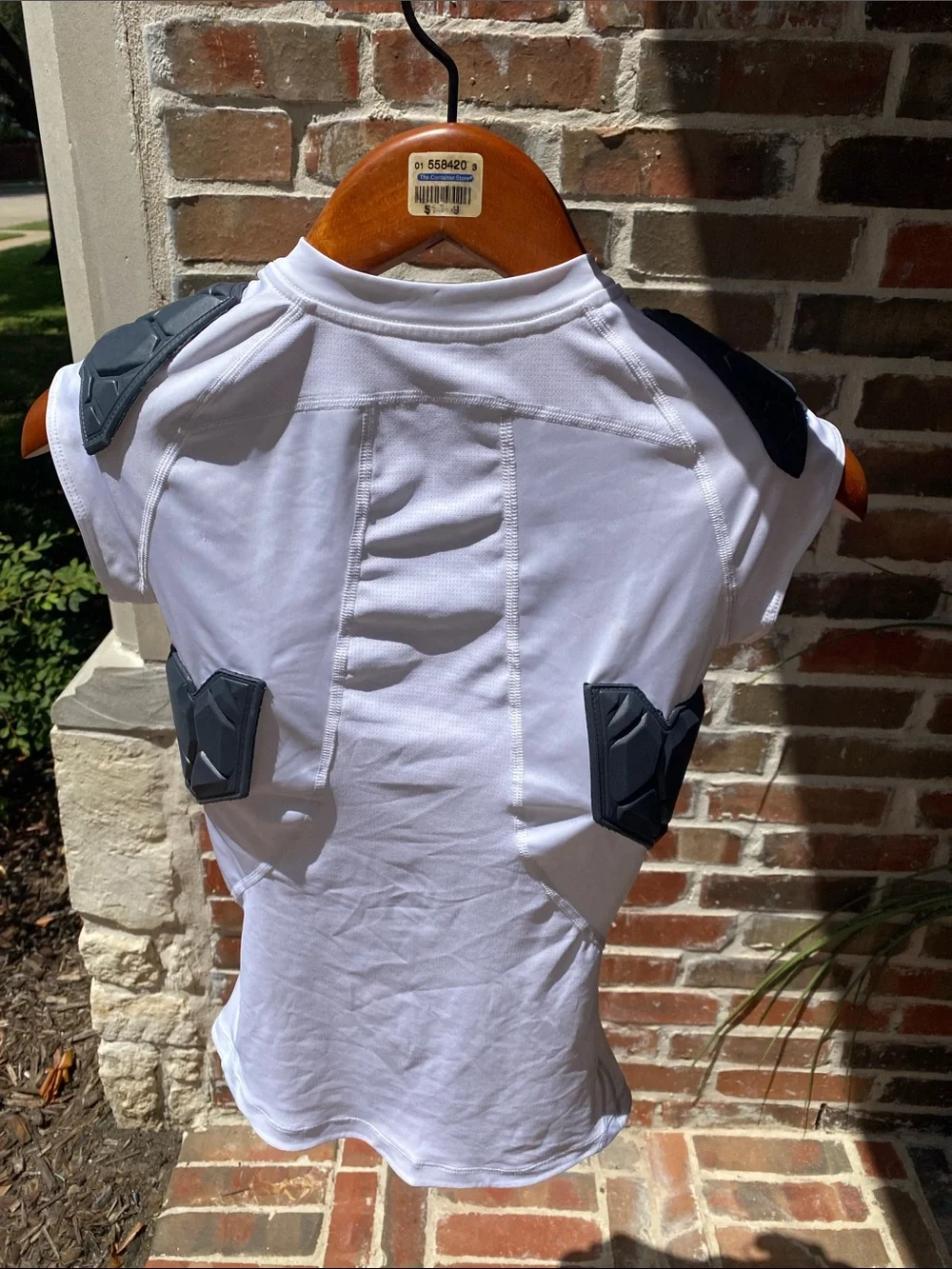 Nike Kids Protective Padded Athletic Shirt in white with Black Pads